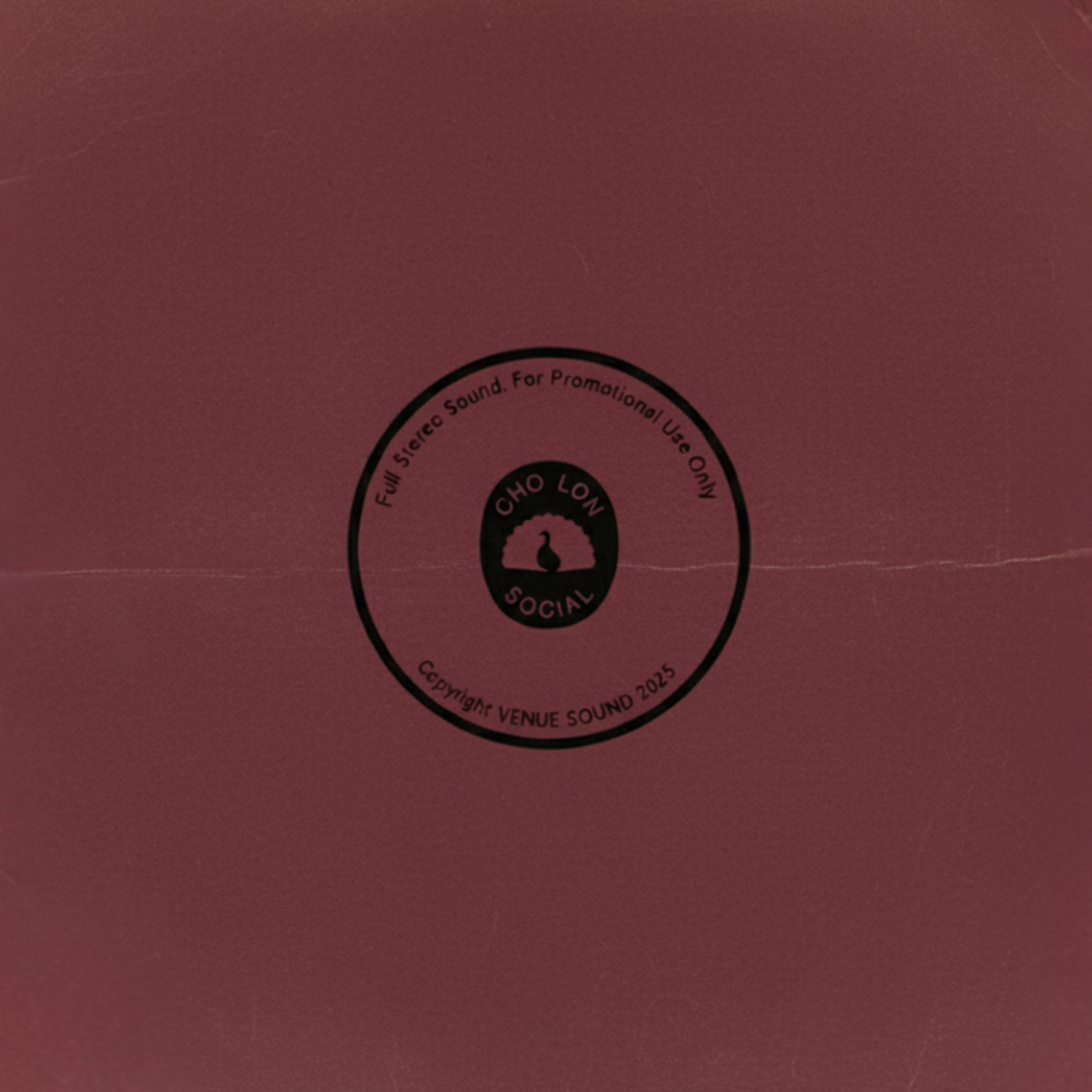 Maroon vinyl record with a black label in the center